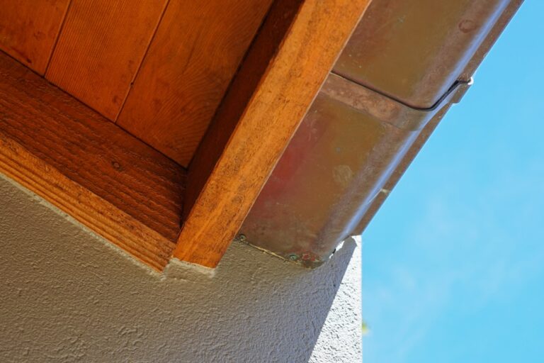 Detailed close-up shot of old, weathered roof shingles showing cracks and moss, symbolizing the need for roof inspection a...