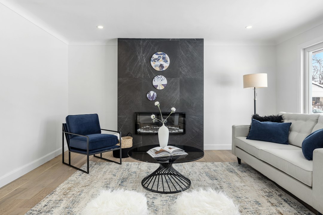 A beautifully staged, bright, and modern living room with clean lines and minimalist decor, showcasing a home prepared for a successful sale in a shifting market.